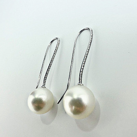 купить Золотые серьги с жемчугом и бриллиантами 0,24 карат в Москве