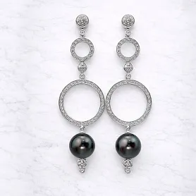 купить Золотые серьги с жемчугом и бриллиантами 0,73 карат в Москве